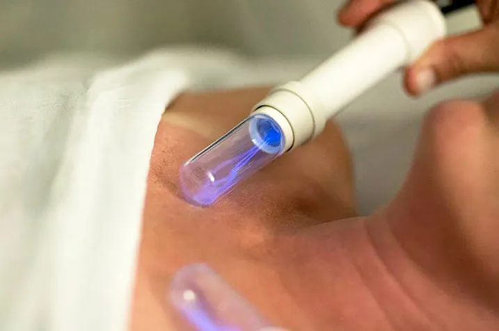 A client receiving a gentle lymphatic enhancement therapy session